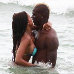 Striker Mario Balotelli and his fiancee Fanny Neguesha show a public display of affection in the water in Miami Beach